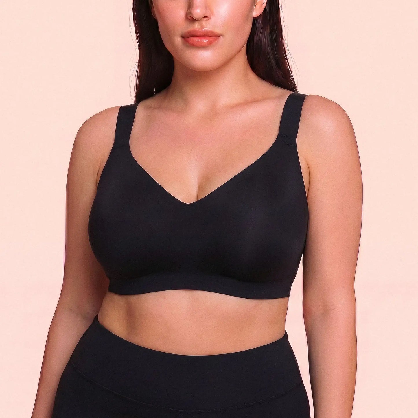 Plus size model in The Jelly Bra black deep V – soft seamless gel bra that hides side fat, no wire